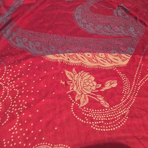 gray, red, and tan fringed scarf