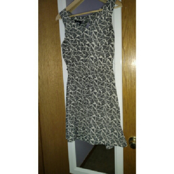 Darling cream and black dress with cutout!