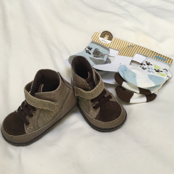Baby boots and 3 pairs of nwt socks.