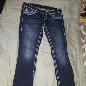 Dark jeans with white stitching