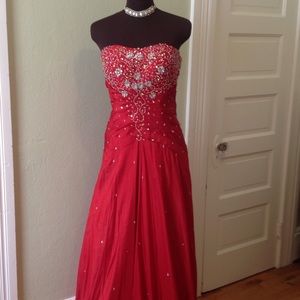 Beautiful red formal gown with sequins and beads.
