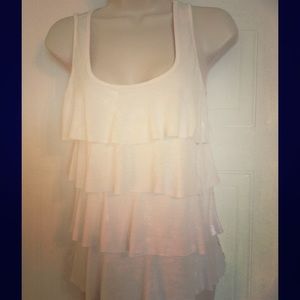 Very cute cream colored top. Back is lacy.