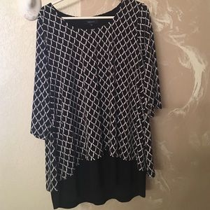 Black & white top with longer bottom, split back