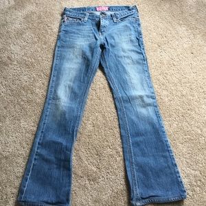 Light blue with pink stitching on backpockets