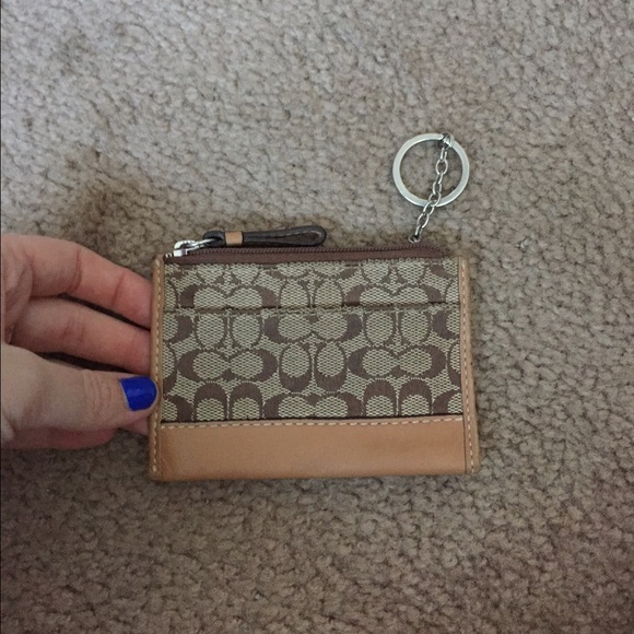Brown and tan coach wristlet wallet