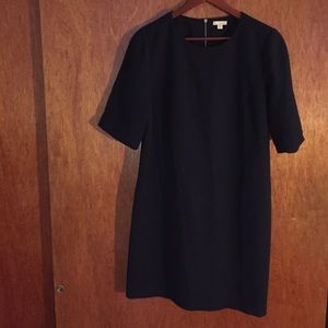 Navy dress with zipped down the back.