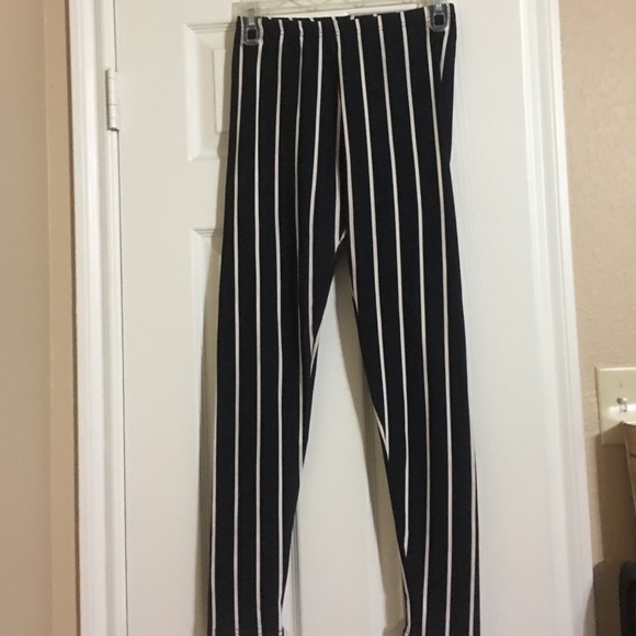 Black leggings with cream colored pinstripes