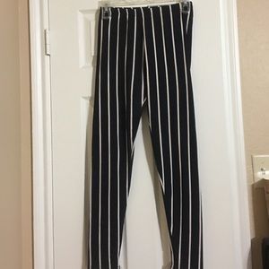 Black leggings with cream colored pinstripes