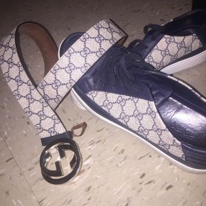 Gucci belt and Gucci sneakers.