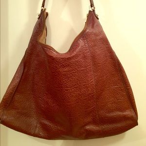 Brown leather shoulder bag.