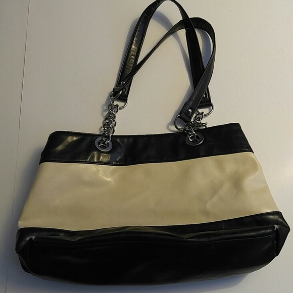 Used black and cream purse