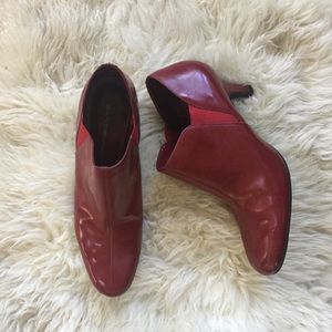 Ruby red patent leather kitten heel booties.