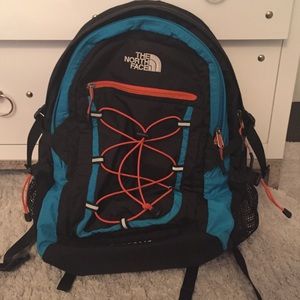 Blue and orange North Face Borealis backpack