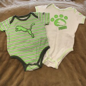 (2) Puma onesies.
