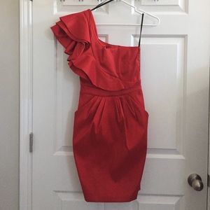 Red one-shoulder ruffle cocktail dress.