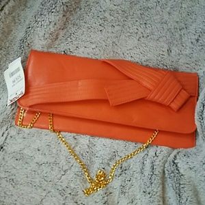 Orange clutch with removable gold chain
