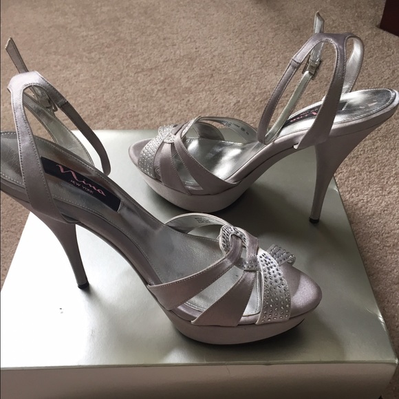High heel silver satin dressy shoe.