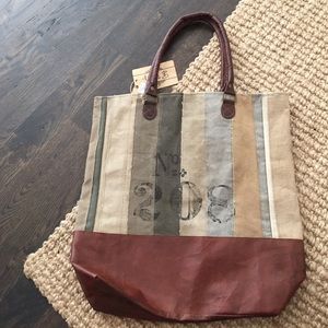 Patched canvas and leather tote bag