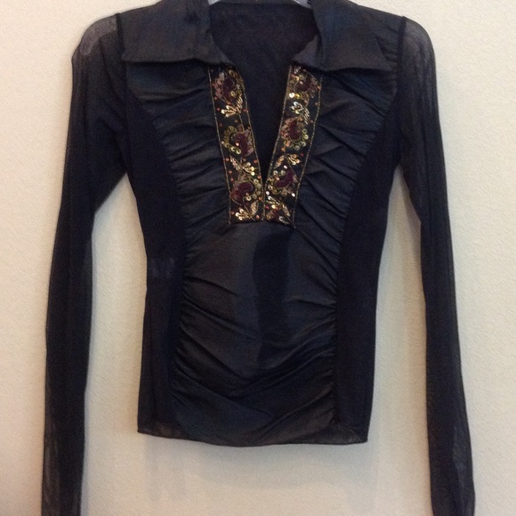 Long sleeve black blouse.