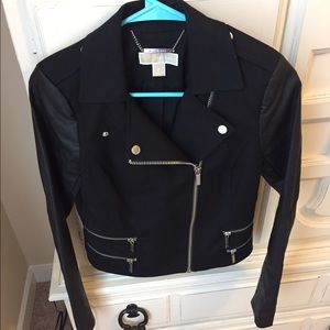 Michael Kors black jacket with leather sleeves.