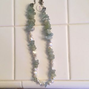 Pearl necklace with Aquamarine stones.