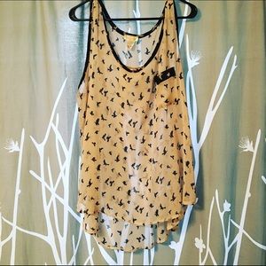 Tunic with bird silhouettes.