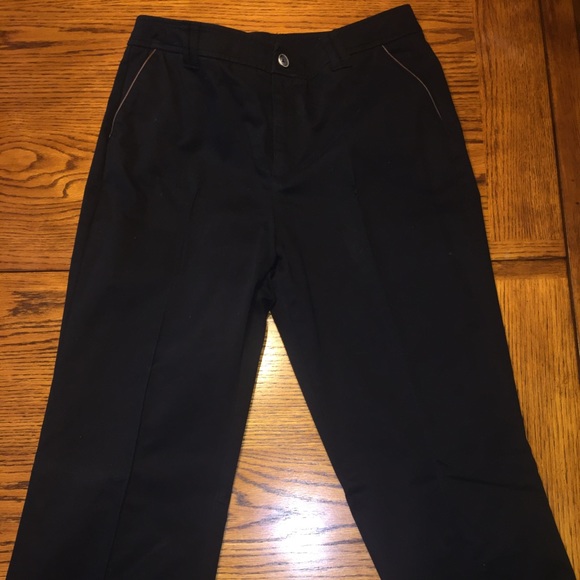 Black pants with brown trim pockets and piping