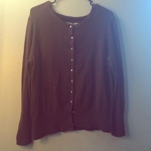 Thick, brown cardigan with rhinestone buttons.
