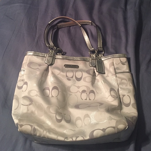 White and silver Coach bag.