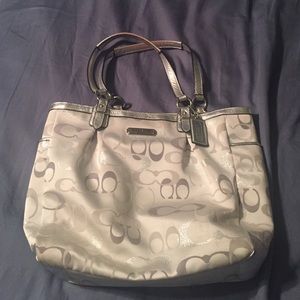 White and silver Coach bag.