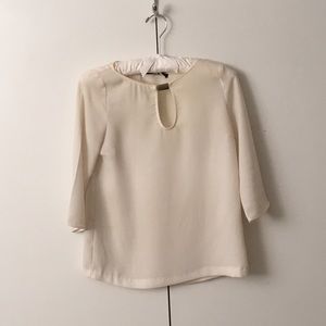 3/4 sleeve cream silk blouse with a keyhole front