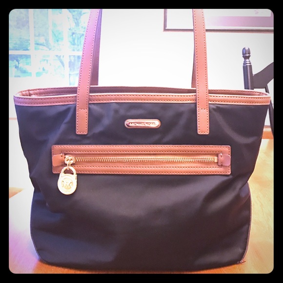 Michael kors Black and Tan handbag.