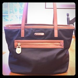 Michael kors Black and Tan handbag.