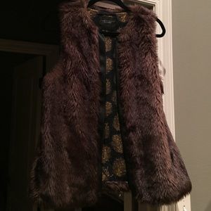 Fur vest with faux leather trim
