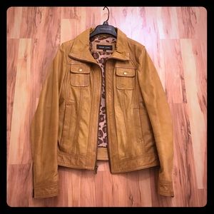 Women's black rivet leather jacket.