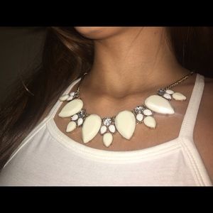 Off white (mostly white) statement necklace.