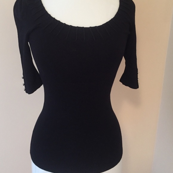 Half sleeves sweater with bling at rim of sleeves.