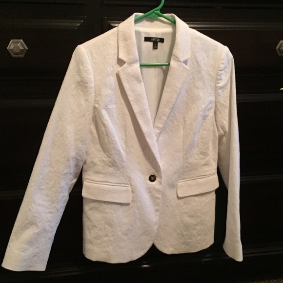 Trendy simple white blazer with great detail!