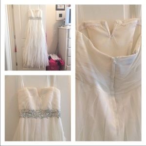 White prom dress with beaded silver on it.