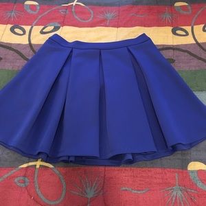 Royal blue pleated skater skirt .
