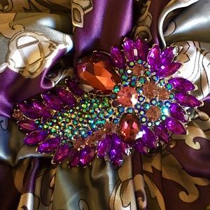 Brooch,  and scarf made in Italy.
