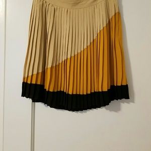 Fully lined, pleated, preppy mini skirt