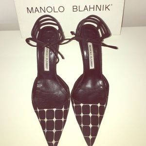 Black and white Manolo Blahnik front tie pumps