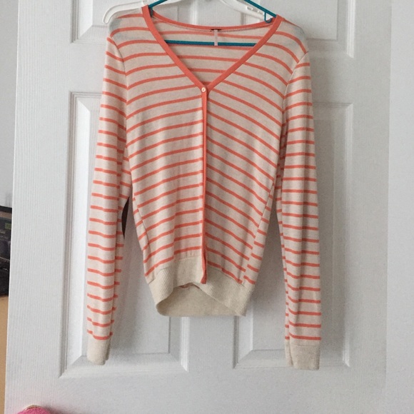 Coral striped sweater with brown elbow patches.