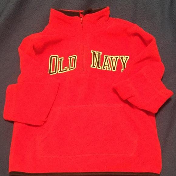 Red pullover with black and white lettering and front pocket