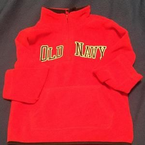 Red pullover with black and white lettering and front pocket