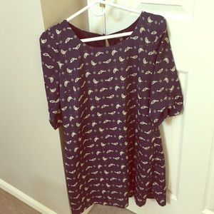 Navy blue dress with bird pattern.