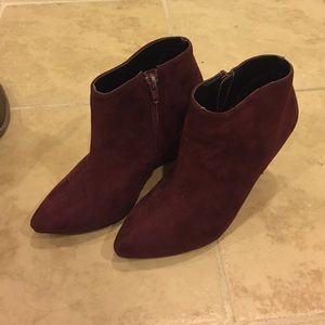 Maroon wedge booties.