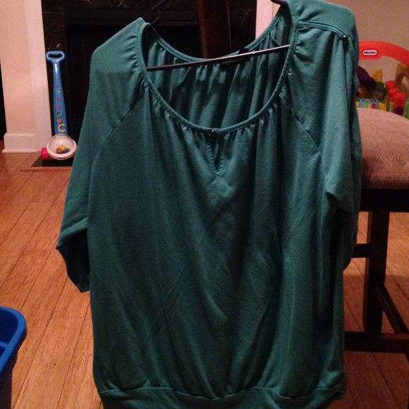 Turquoise top with peekaboo sleeves.