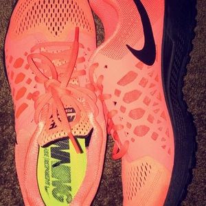 nike pegasus , like a pinkish- orange